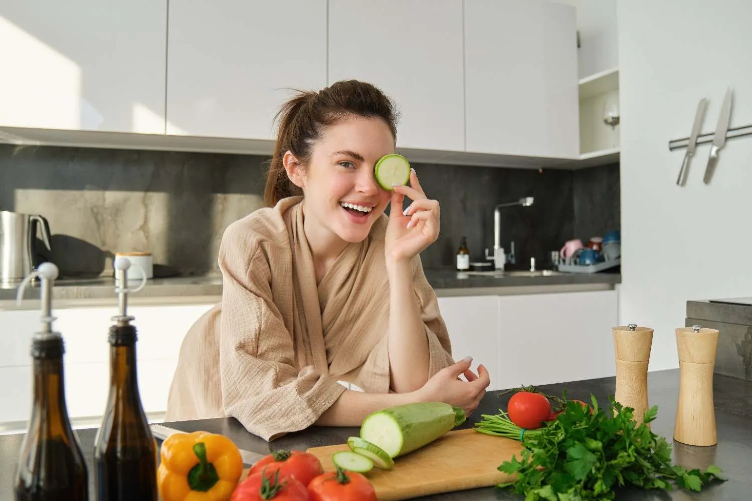 Woman with fresh vegetables in a bright kitchen