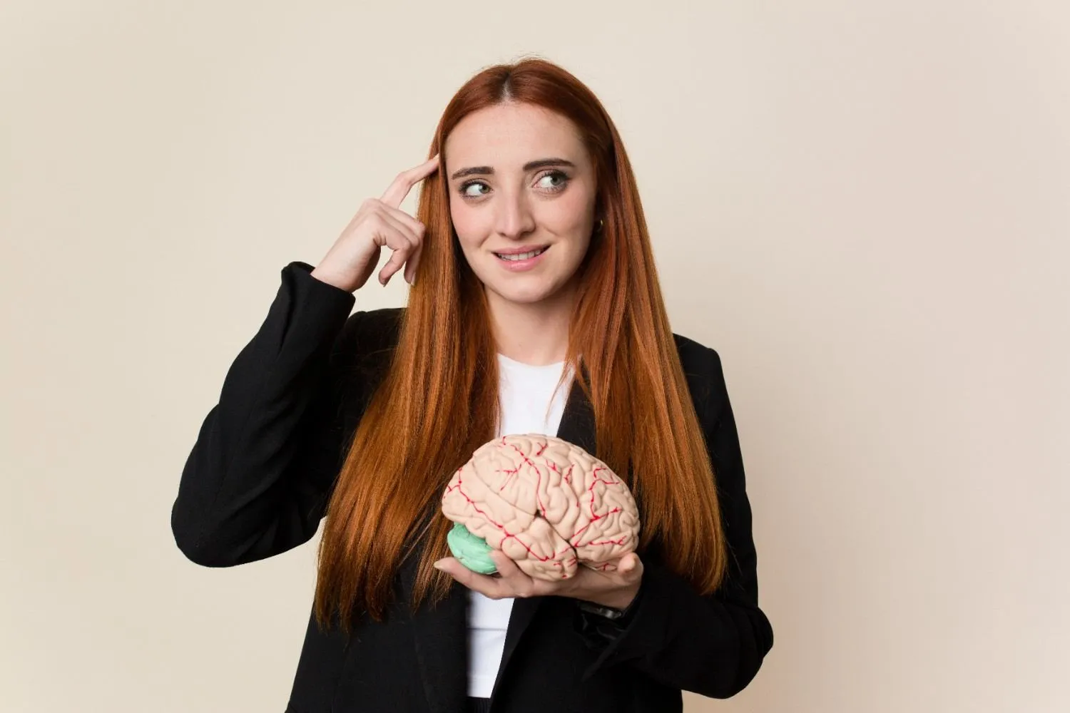 Woman holding a model of a human brain